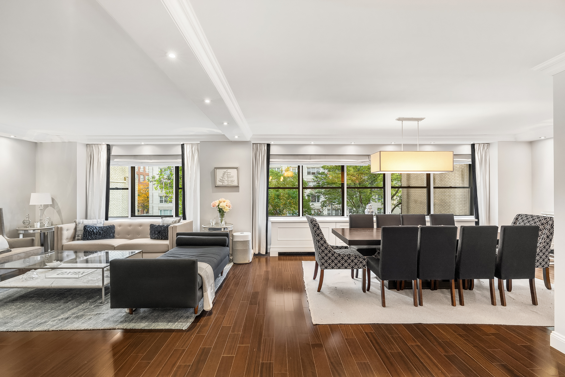 178 East 80th Street, Unit 3A Manhattan, NY 10075 - Photo 1 of 14 a living room with furniture and a large window