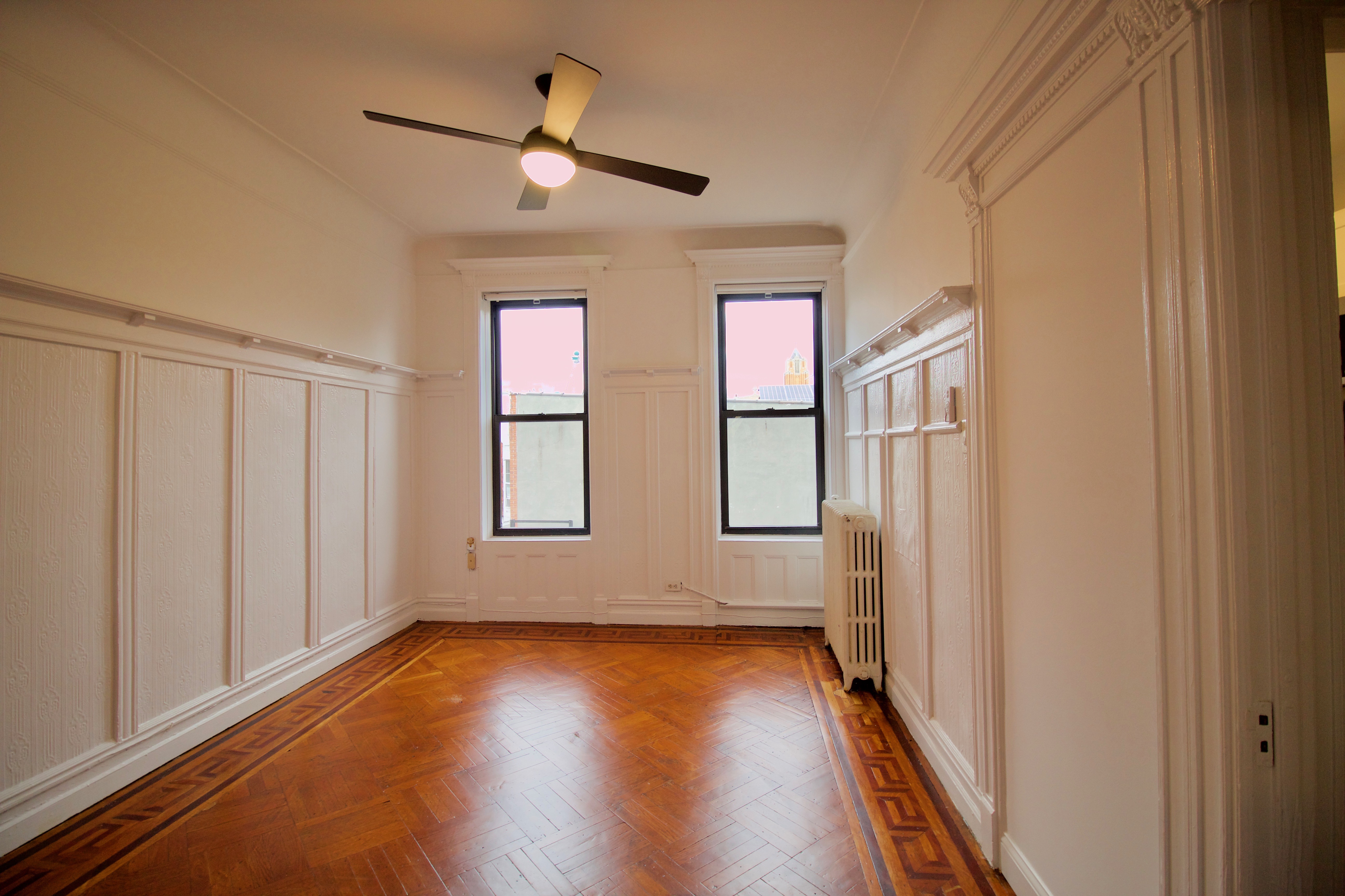 403 Caton Avenue, Unit 3 Brooklyn, NY 11218 - Photo 14 of 31 wooden floor in an empty room with a window
