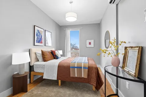 a bedroom with furniture and a bed