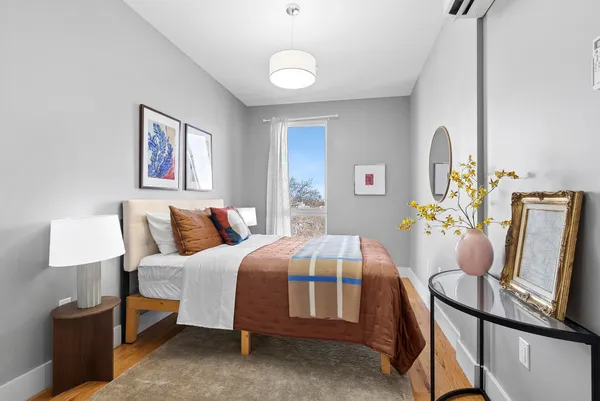 a bedroom with furniture and a bed