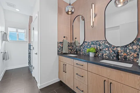 a bathroom with a sink and mirror