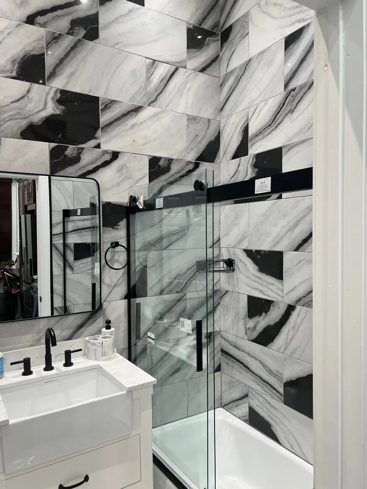 a bathroom with a sink and mirror