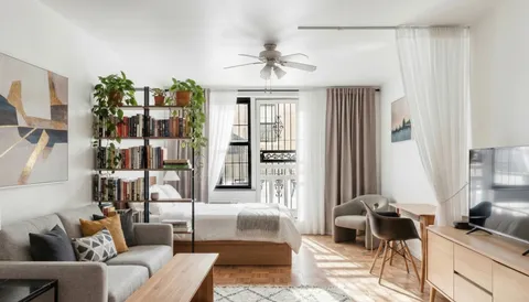 a living room with furniture and a window
