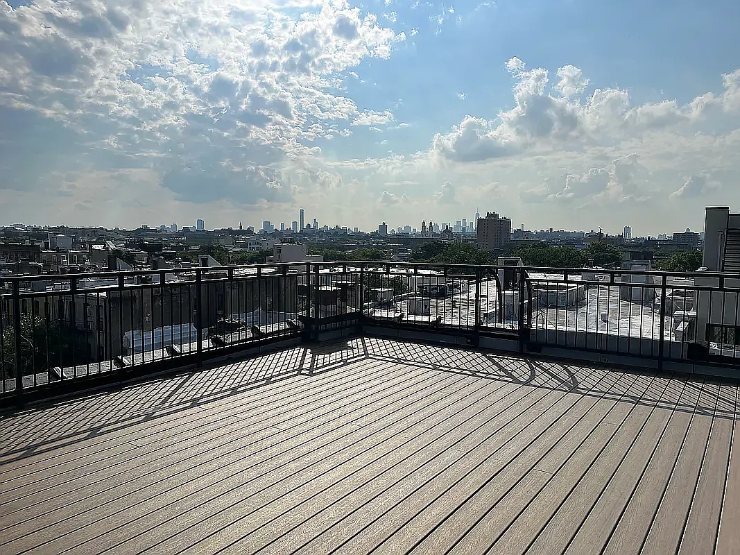 285 Cornelia Street, Unit 3R Brooklyn, NY 11221 - Photo 7 of 10 a view of a balcony with wooden floor