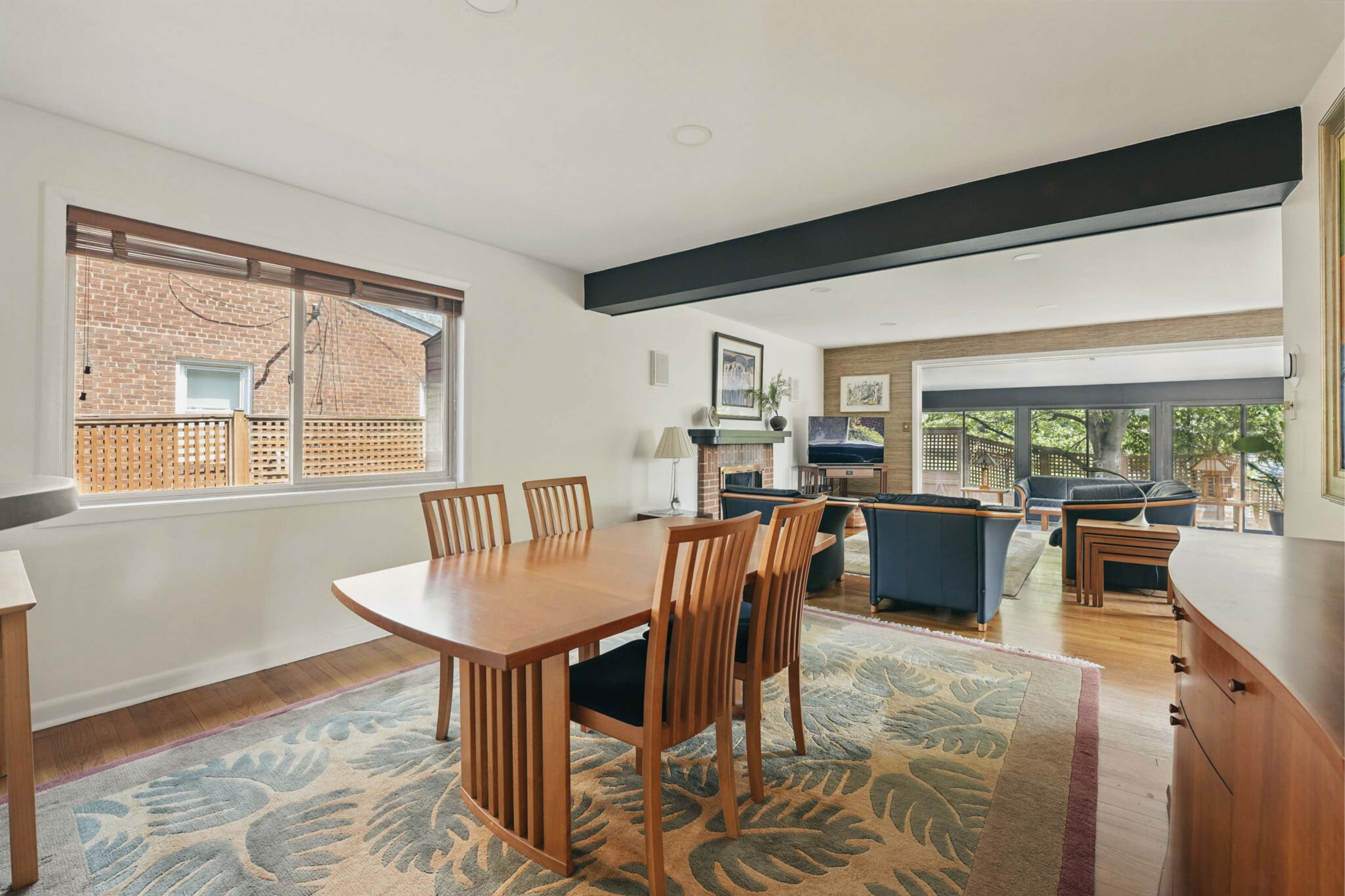 8003 16th Street Northwest Washington, DC 20012 - Photo 17 of 38 a dining room with furniture a chandelier and wooden floor