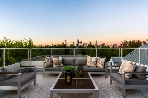 a view of a roof deck with couches