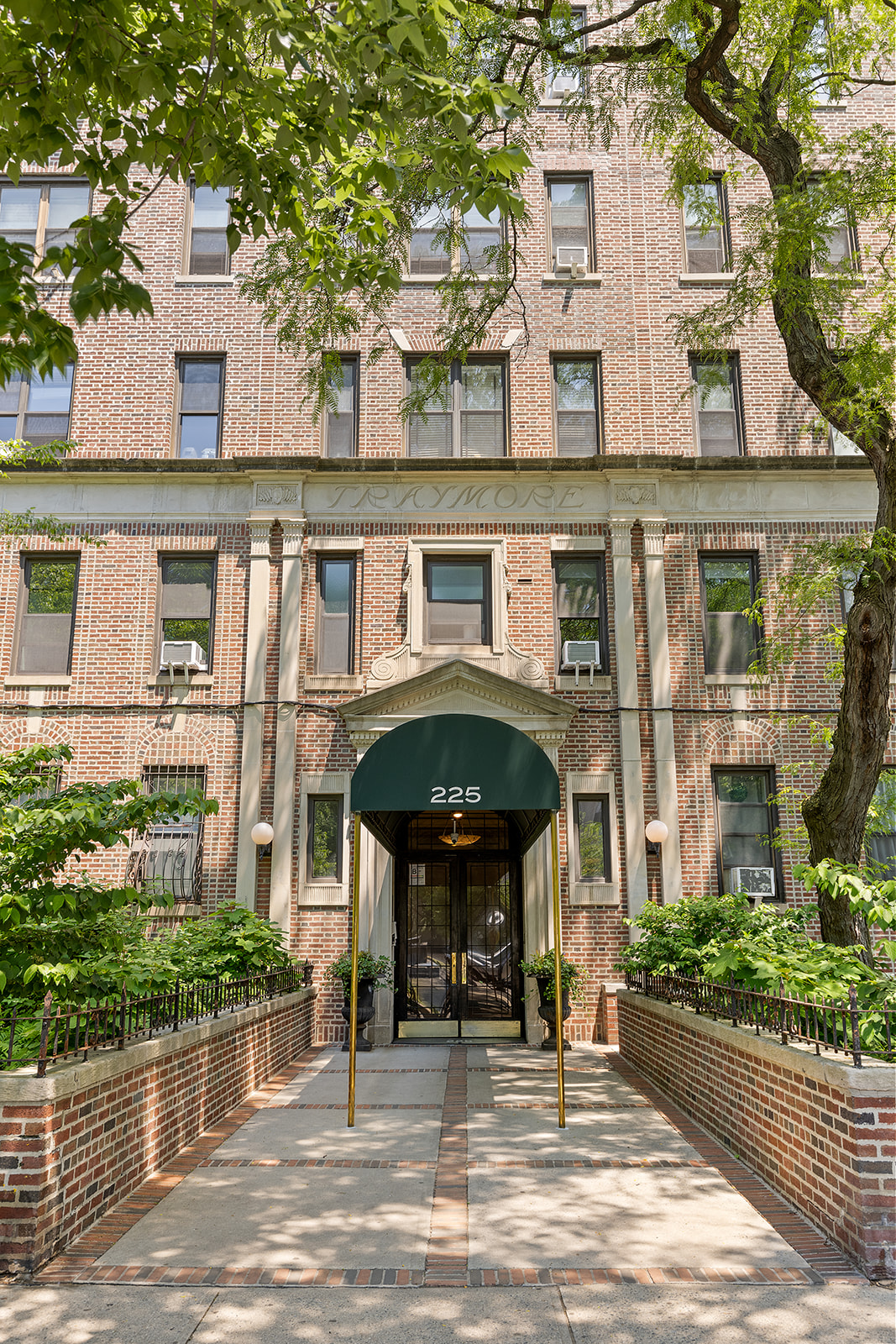 225 Eastern Parkway, Unit 6C Brooklyn, NY 11238 - Photo 10 of 12 front view of a building with a garden