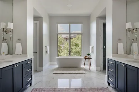 a living room with a furniture and a large window