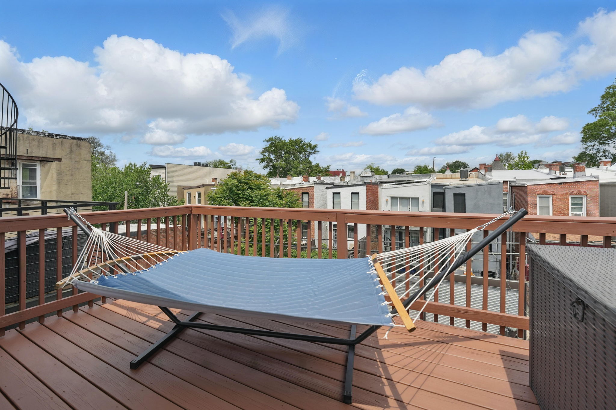 28 Q Street Northeast, Unit 2 Washington, DC 20002 - Photo 34 of 41 a view of a roof deck with wooden floor and fence