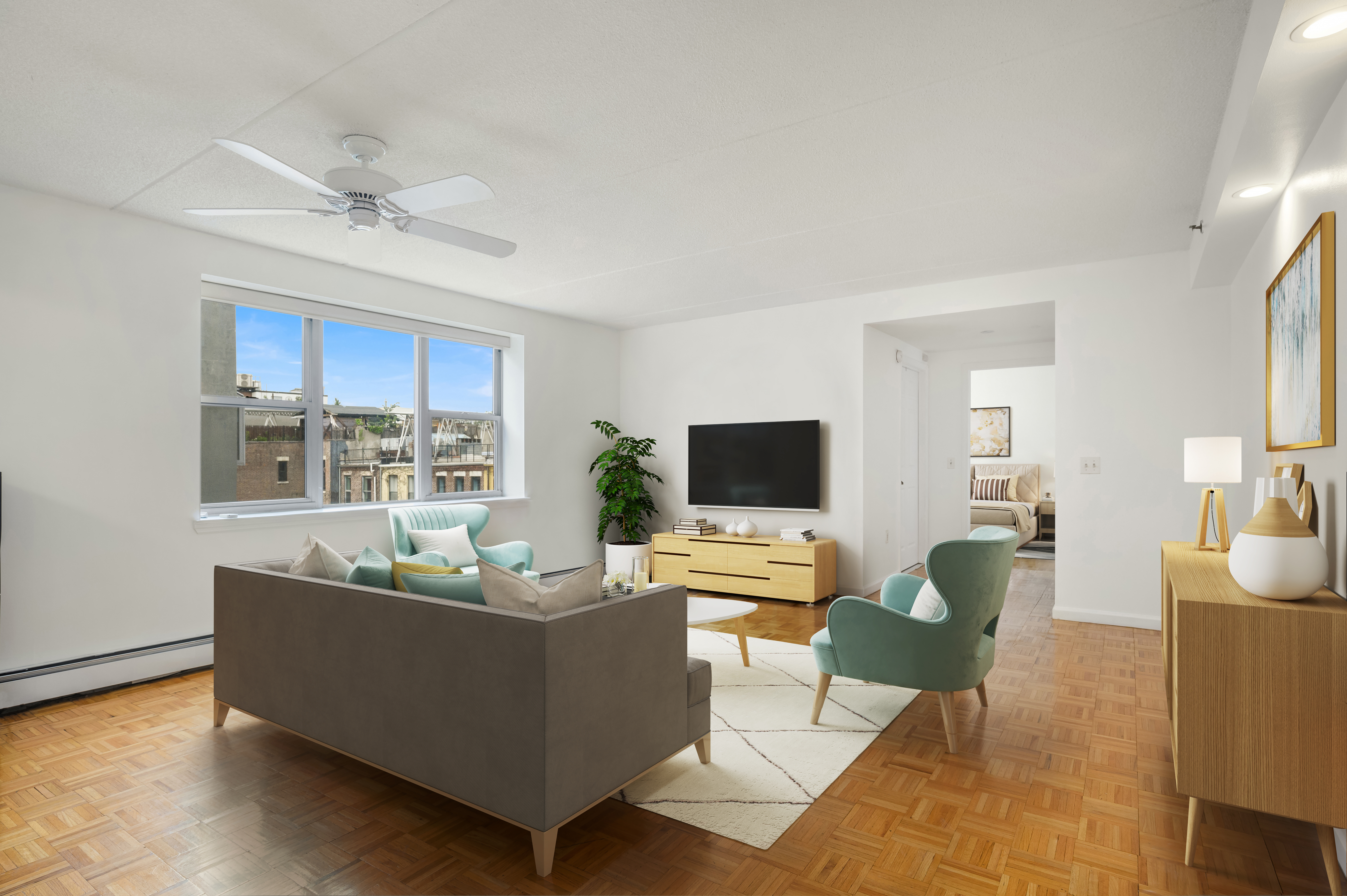 101 West 117th Street, Unit 5E Manhattan, NY 10026 - Photo 2 of 8 a living room with furniture and a flat screen tv