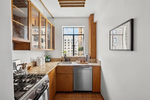 a kitchen that has a sink and a stove