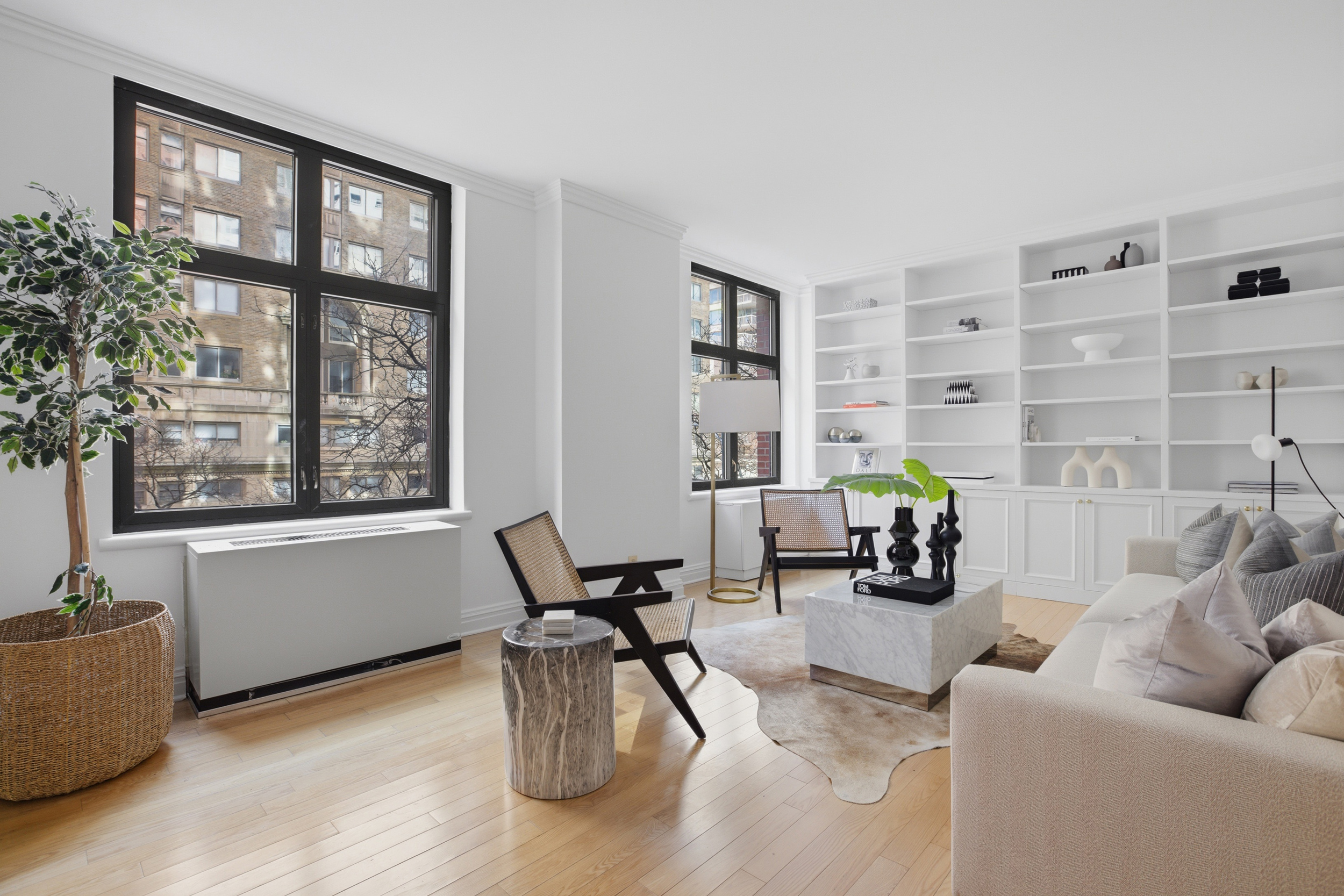 188 East 70th Street, Unit 3A Manhattan, NY 10021 - Photo 3 of 18 a living room with furniture and wooden floor