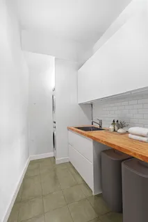 a view of a kitchen with sink and dishwasher