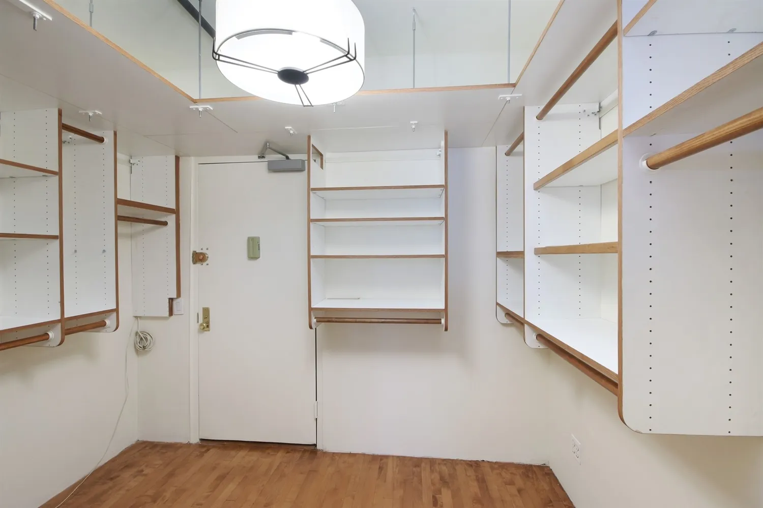 a view of a room with a ceiling fan