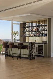 a dining room with furniture and wooden floor