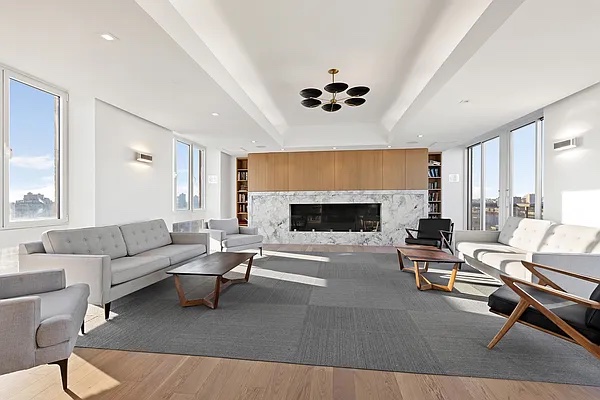 250 West 90th Street, Unit PH1E Manhattan, NY 10024 - Photo 8 of 13 a living room with furniture a fireplace and a flat screen tv