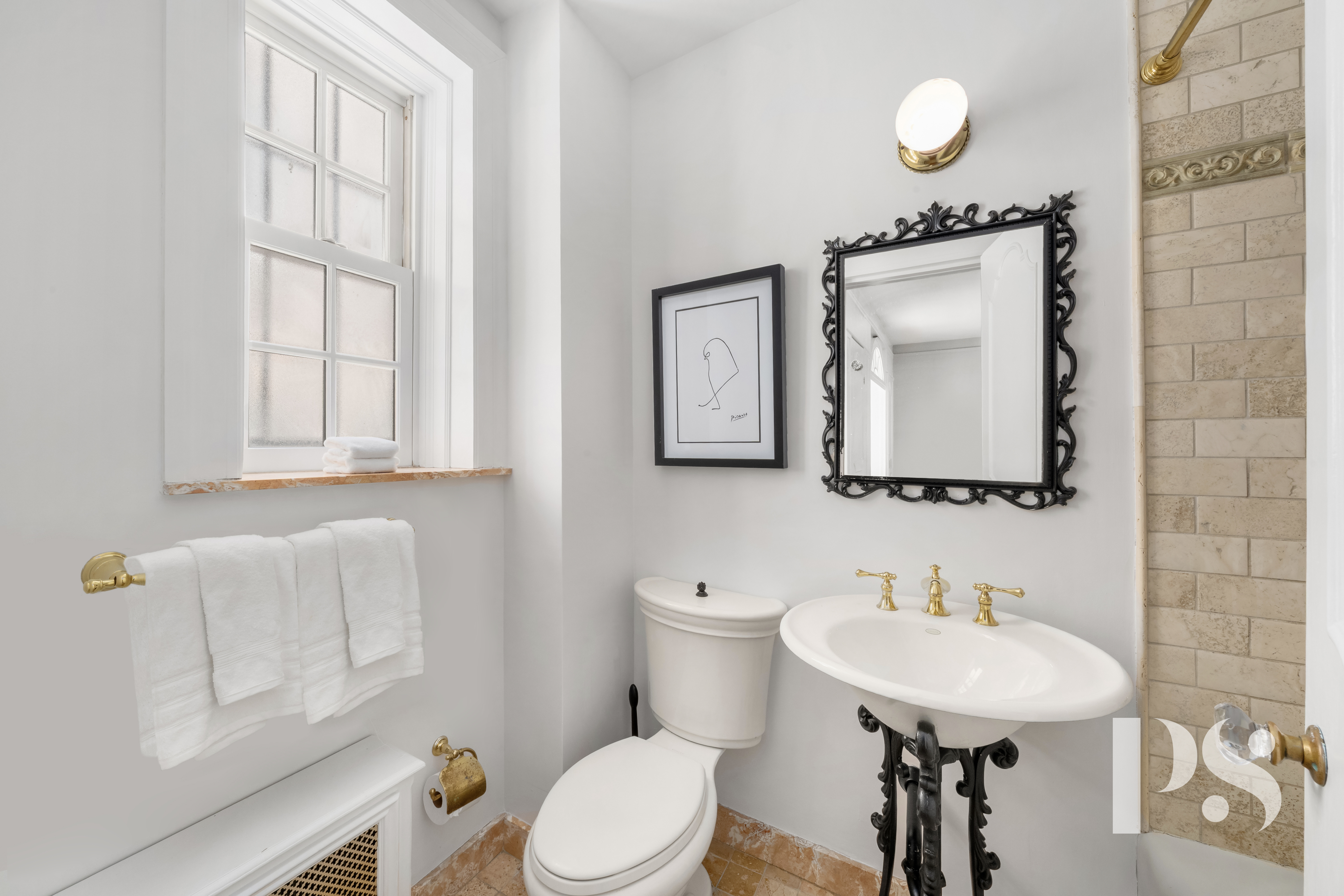 35 East 9th Street, Unit 33 Manhattan, NY 10003 - Photo 10 of 14 a bathroom with a toilet a sink and mirror
