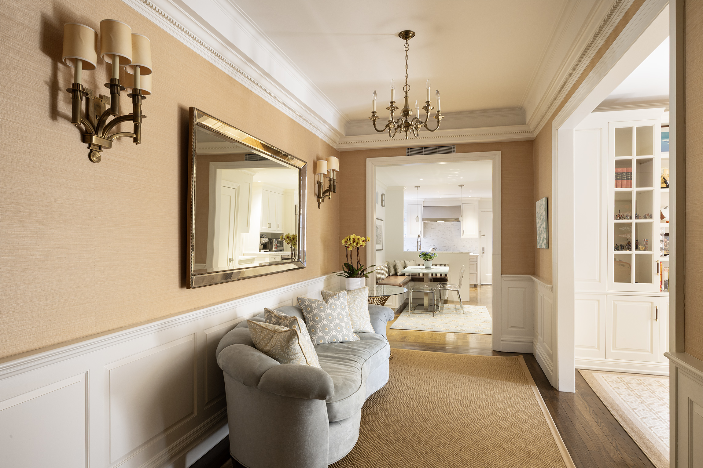 21 East 87th Street, Unit 10D Manhattan, NY 10128 - Photo 5 of 11 a living room with furniture and a chandelier