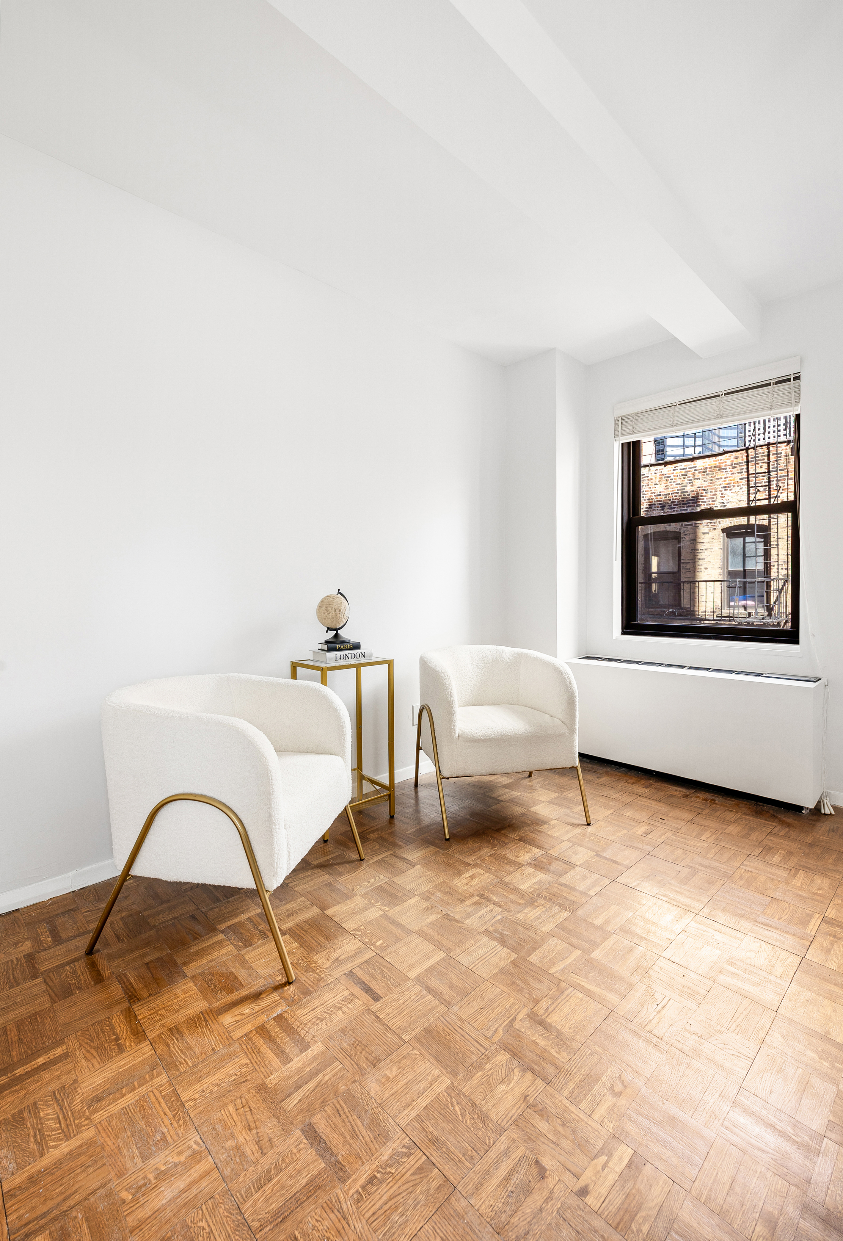 235 East 49th Street, Unit 6G Manhattan, NY 10017 - Photo 14 of 22 a bedroom with a bed and a chair