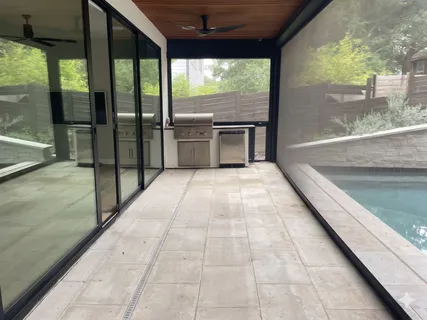 an empty room with a window and wooden floor