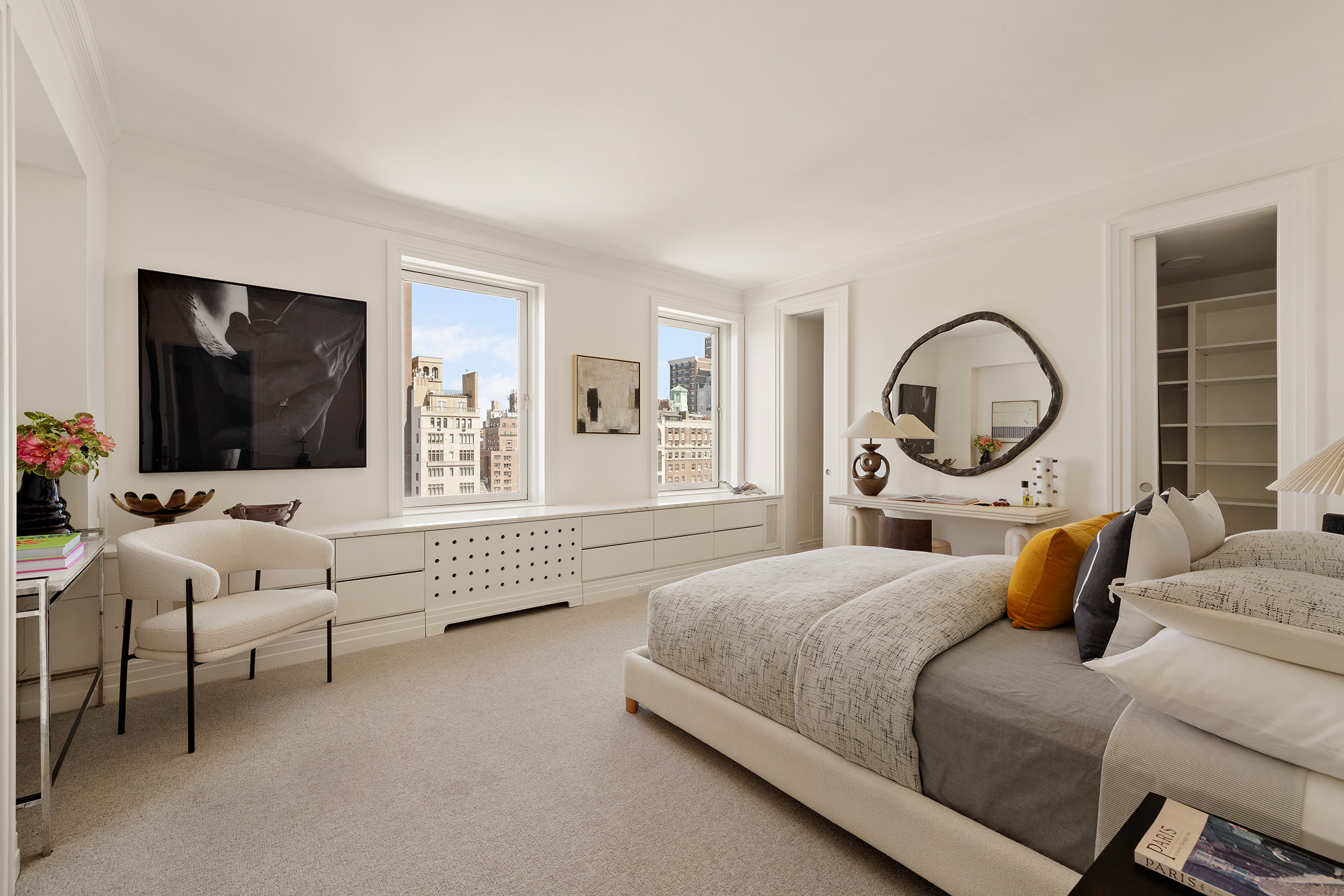 969 5th Avenue, Unit 14 Manhattan, NY 10075 - Photo 8 of 17 a bedroom with bed and a flat screen tv