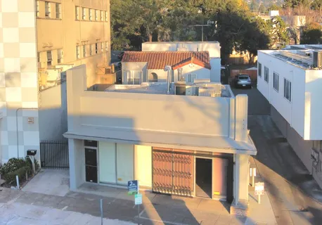 a view of a building with a tree