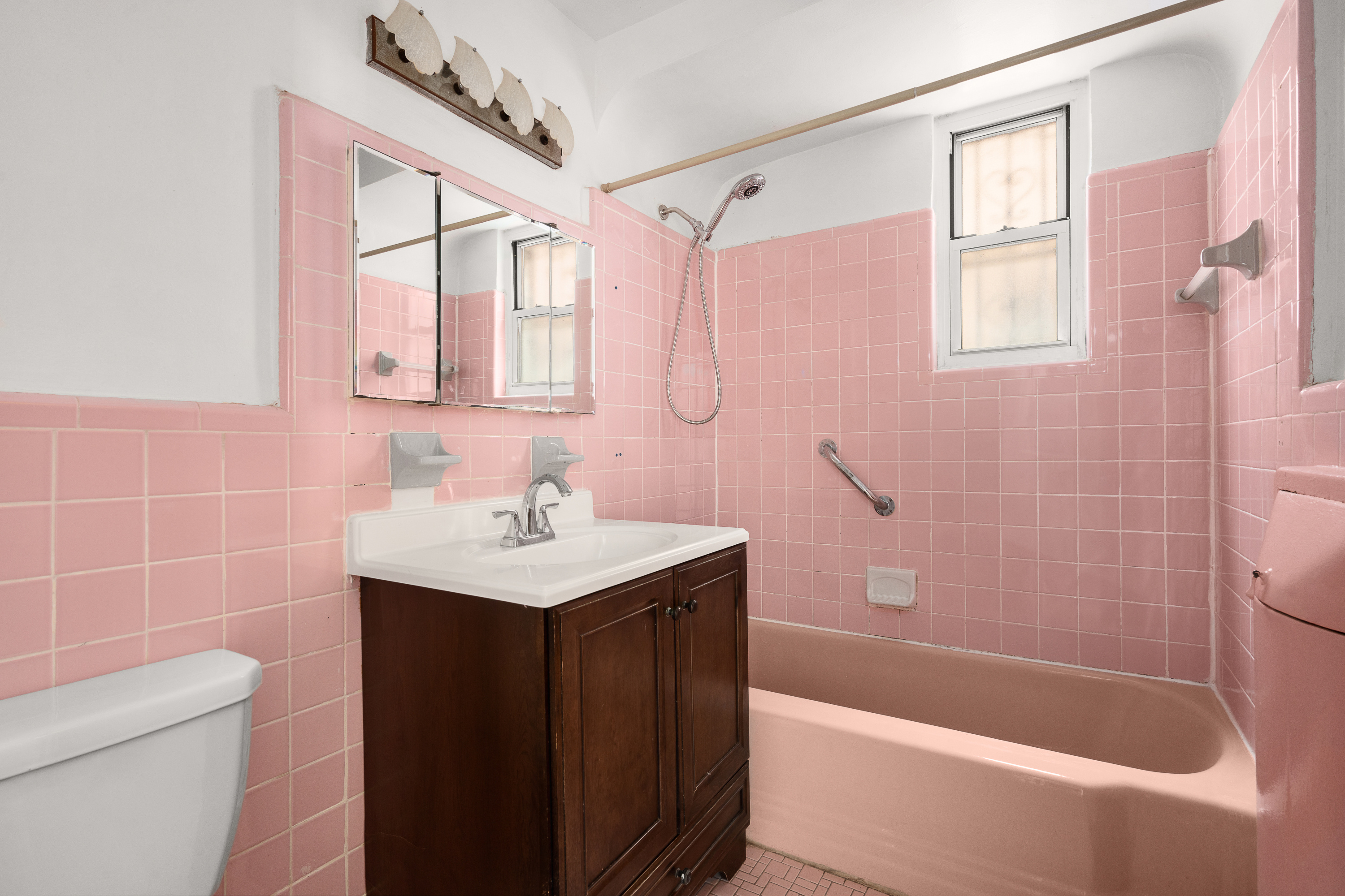 1268 East 52nd Street Brooklyn, NY 11234 - Photo 10 of 13 a bathroom with a sink toilet tub and shower