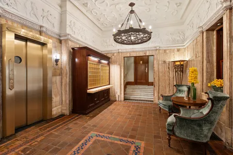 a view of a livingroom with furniture and chandelier