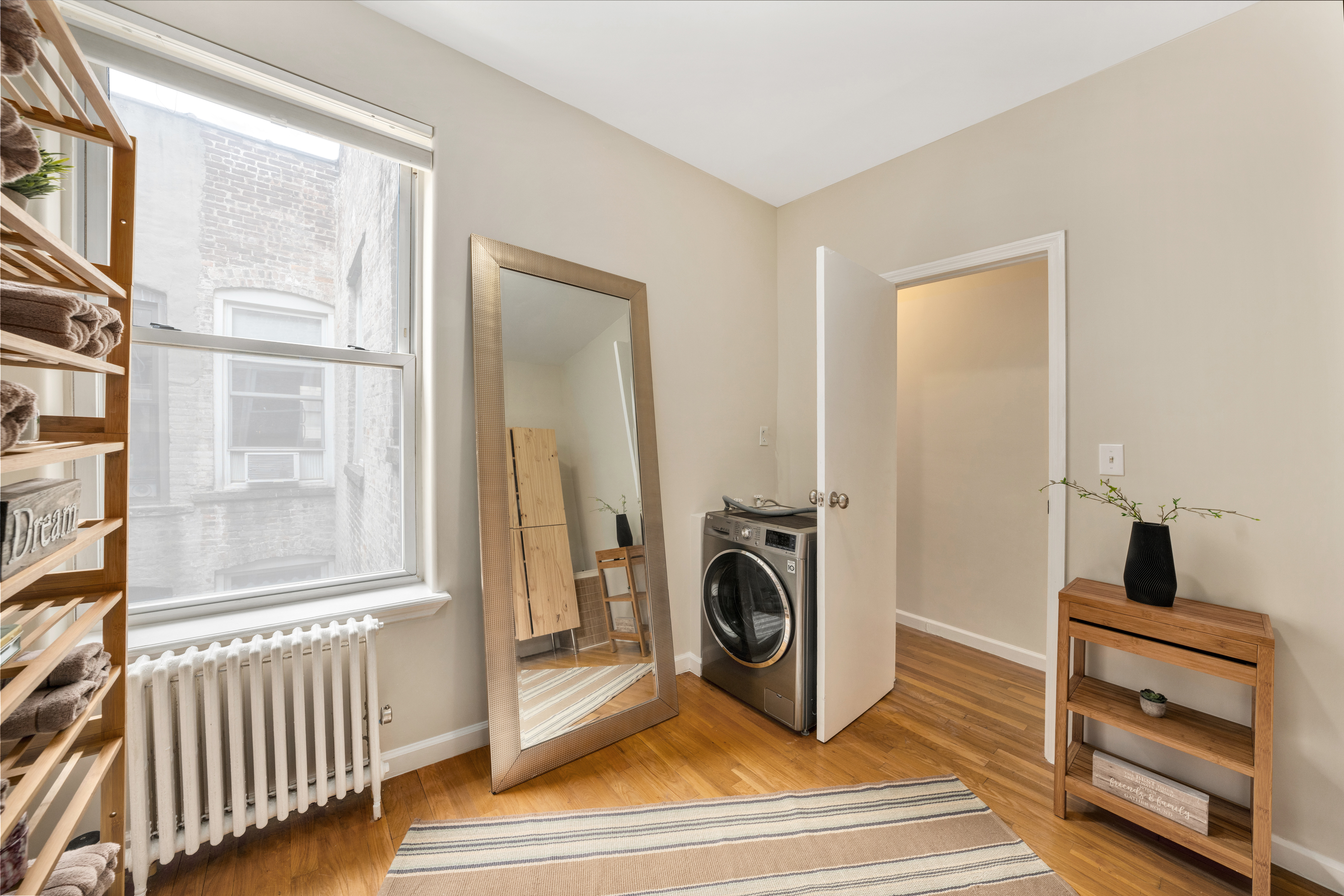 1286 Halsey Street, Unit 3B Brooklyn, NY 11237 - Photo 5 of 10 a view of a livingroom with a fireplace and a window