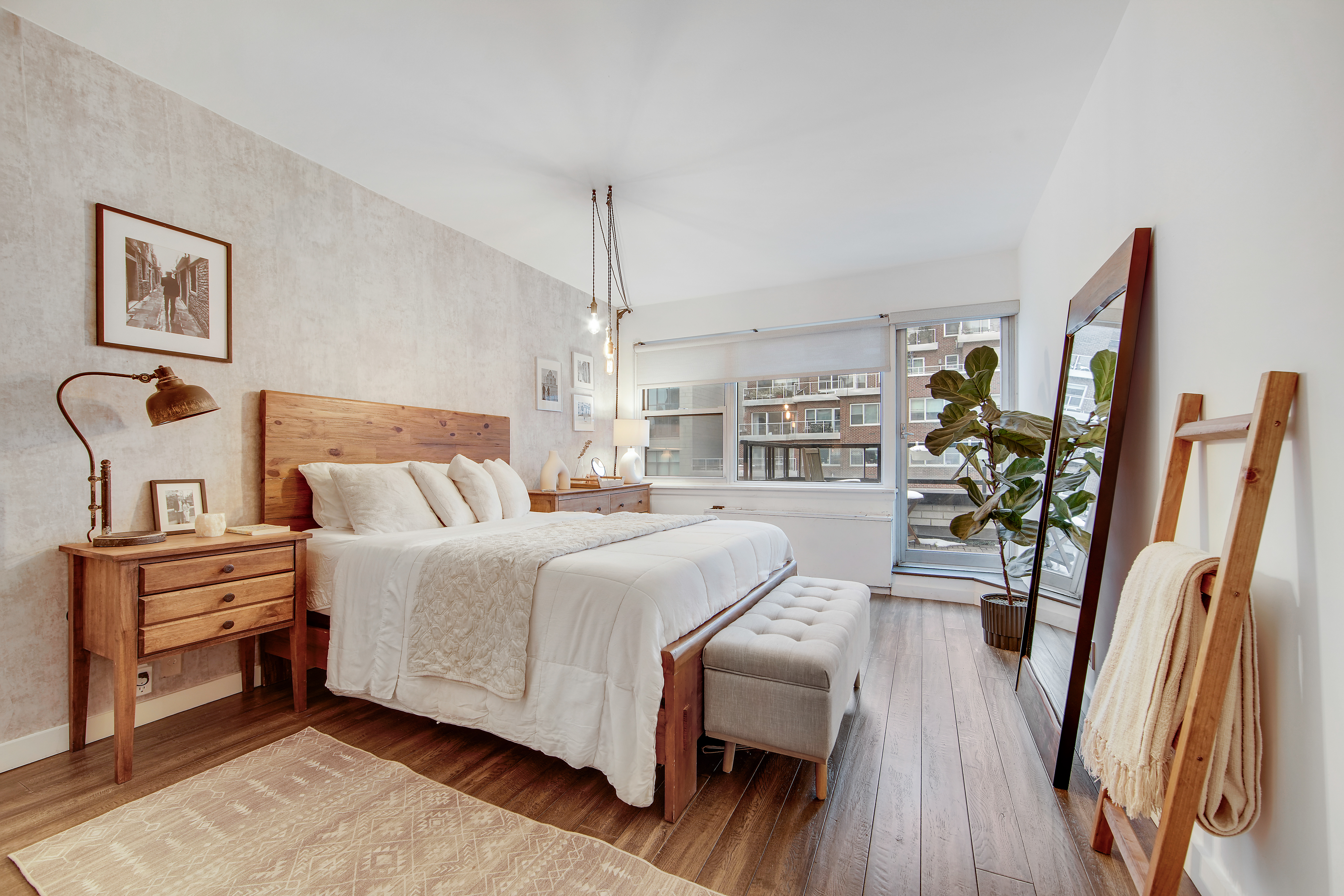 175 East 62nd Street, Unit 18B Manhattan, NY 10065 - Photo 9 of 17 a bedroom with a bed and wooden floor