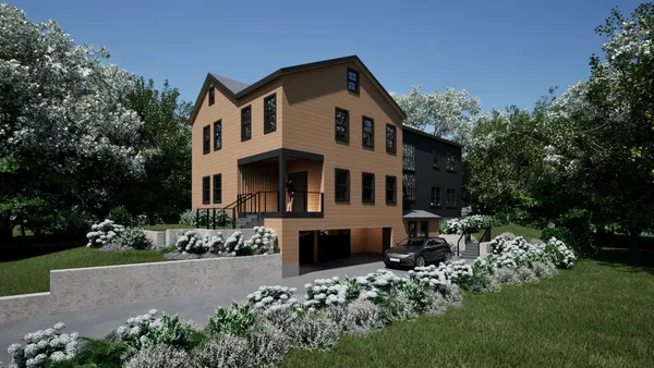 a front view of a house with a garden
