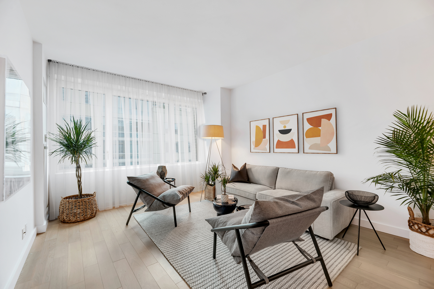 34 North 7th Street, Unit 7E Brooklyn, NY 11249 - Photo 2 of 20 a living room with furniture and a potted plant
