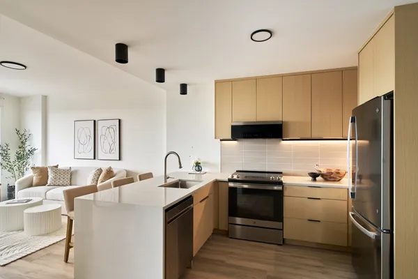 a kitchen with a sink appliances and cabinets