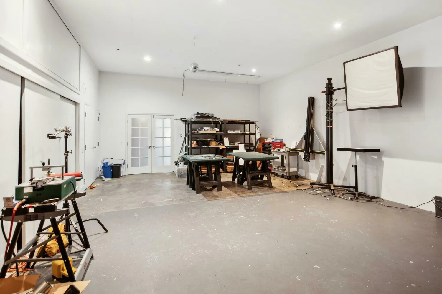 a room with lots of furniture and a chandelier