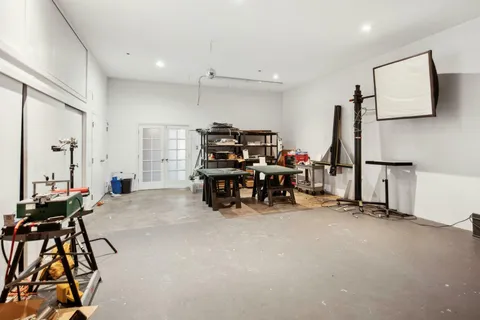 a room with lots of furniture and a chandelier