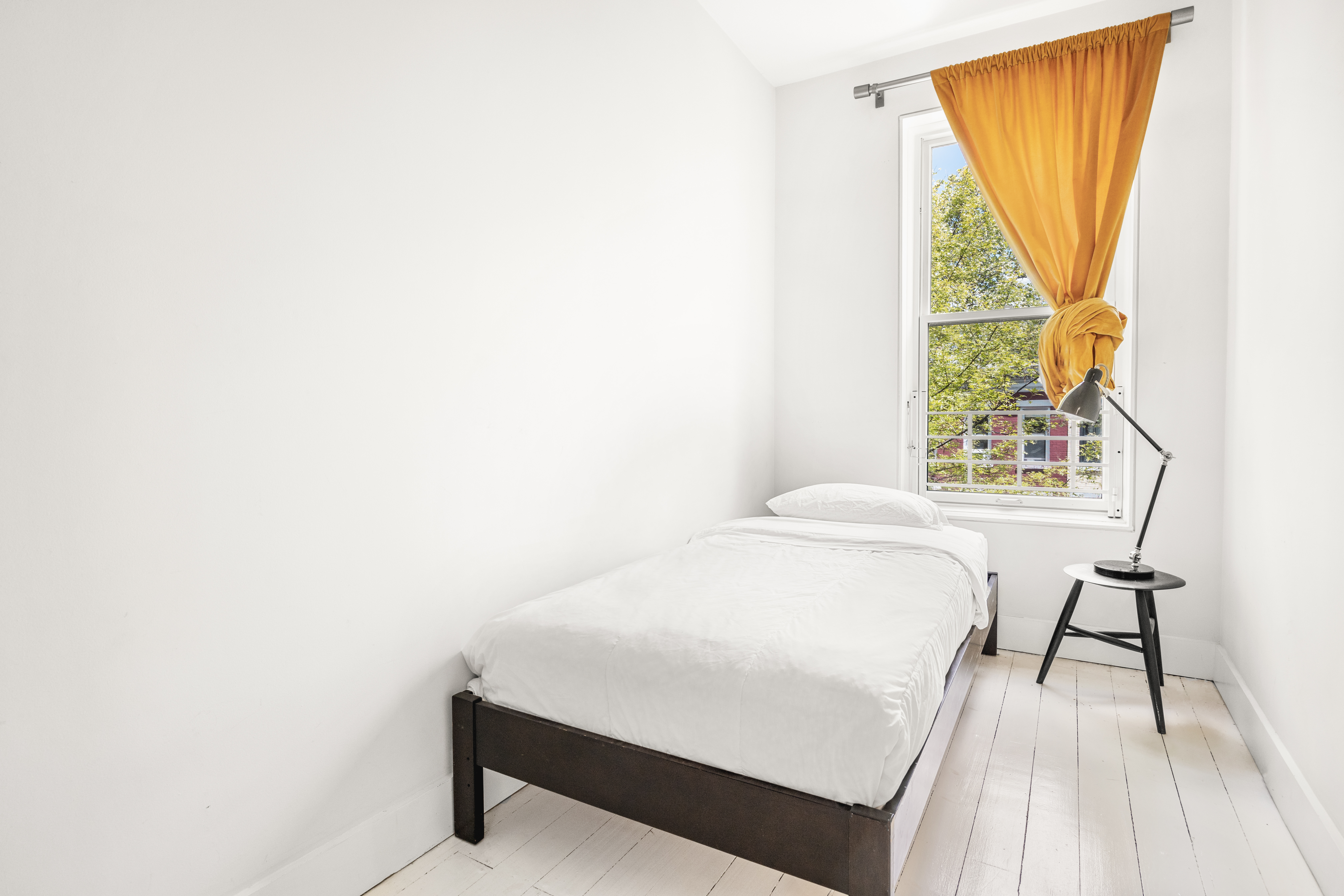 26 A 1st Street Brooklyn, NY 11231 - Photo 13 of 20 a bedroom with a bed and a table