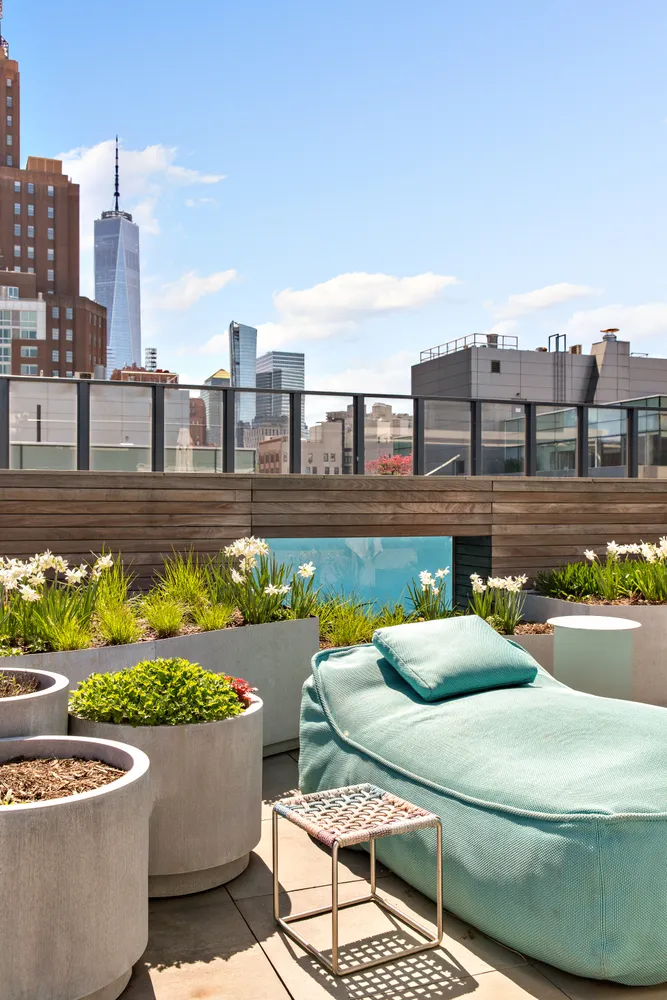 a view of a swimming pool with a lounge chairs