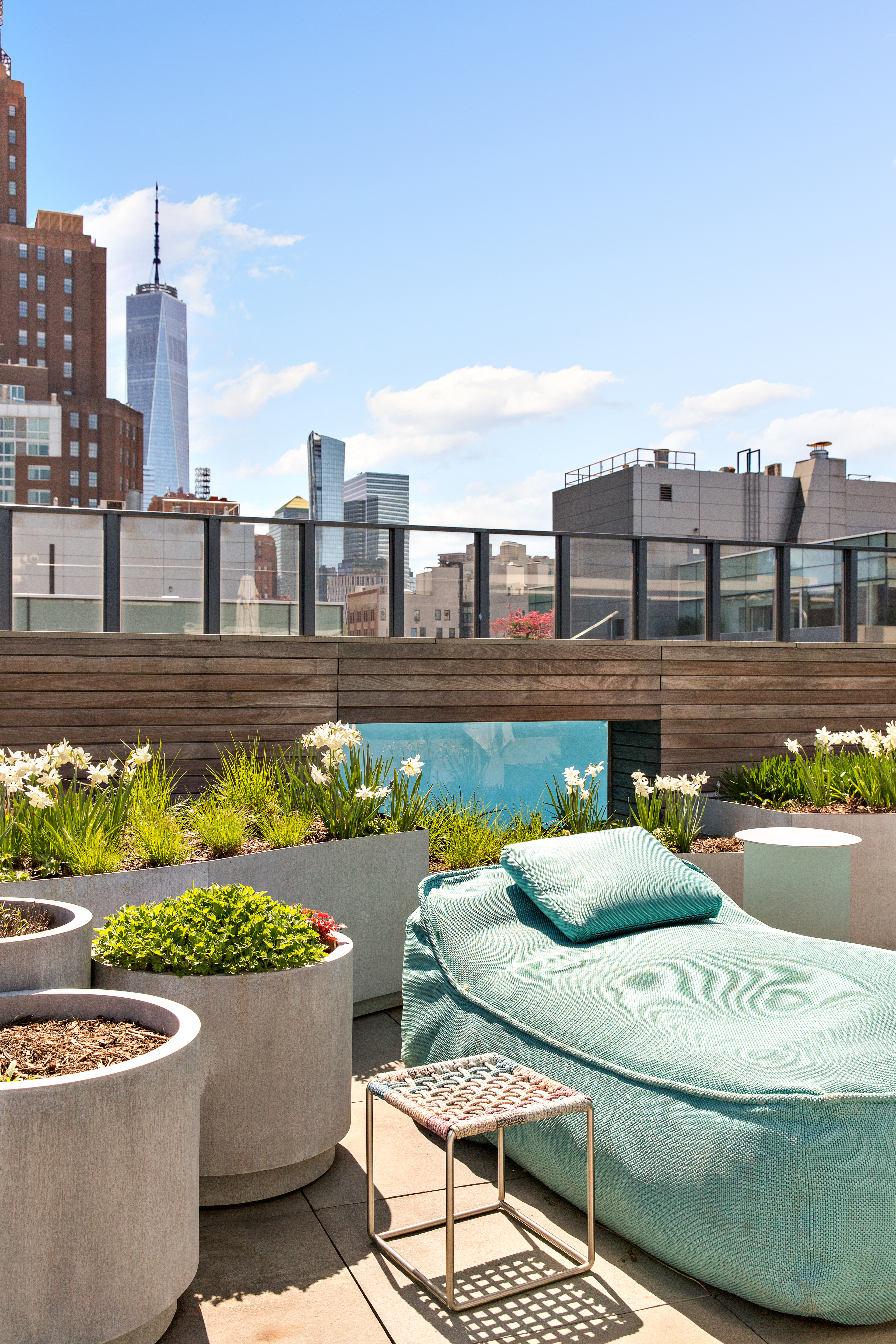 27 Wooster Street, Unit PH Manhattan, NY 10013 - Photo 13 of 34 a view of a swimming pool with a lounge chairs