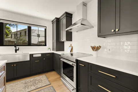 a kitchen with a sink and cabinets