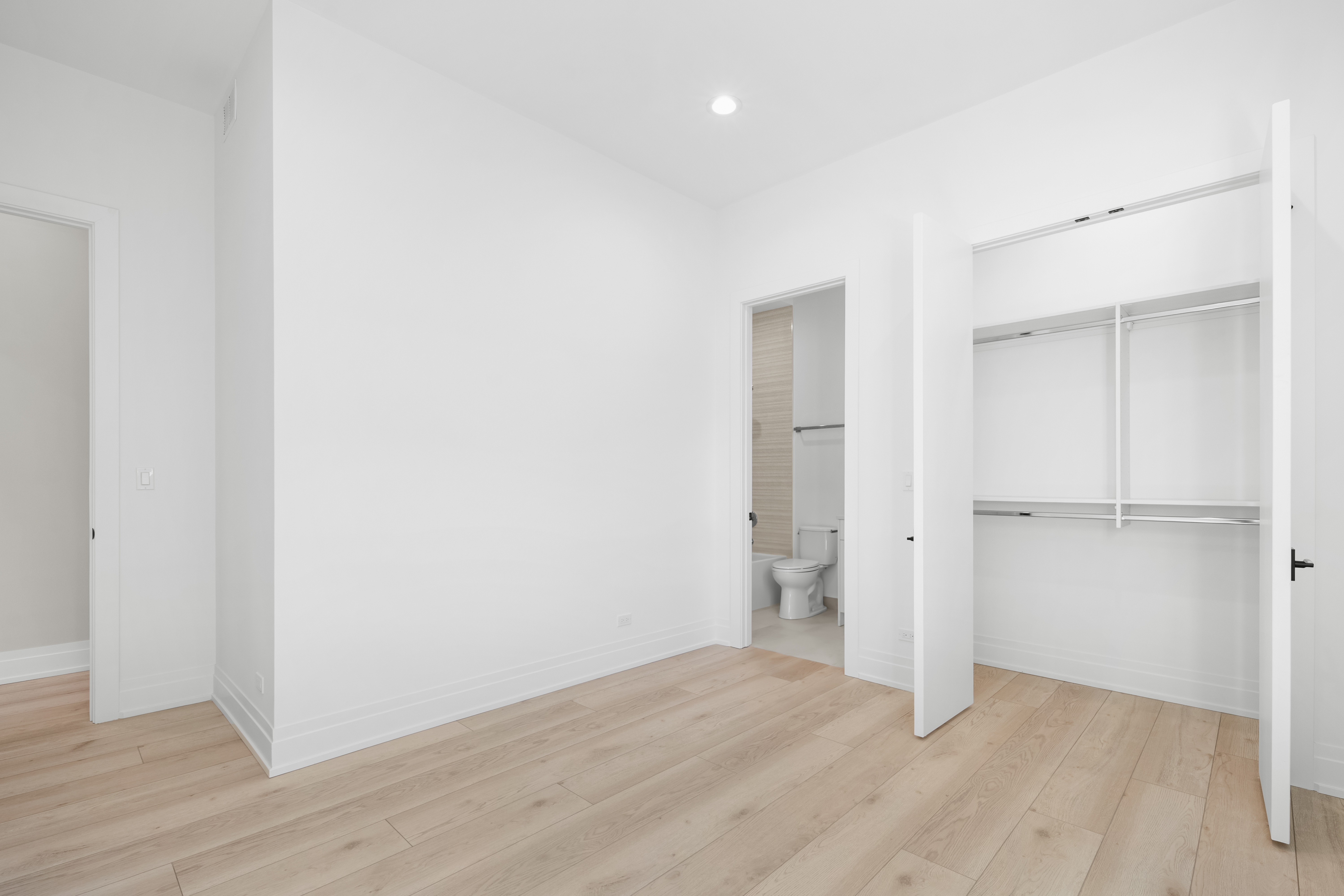 1327 West Taylor Street, Unit 4 Chicago, IL 60607 - Photo 16 of 27 a view of an empty room with wooden floor