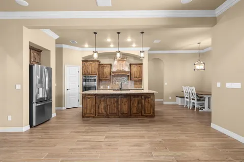 a view of a livingroom with a kitchen