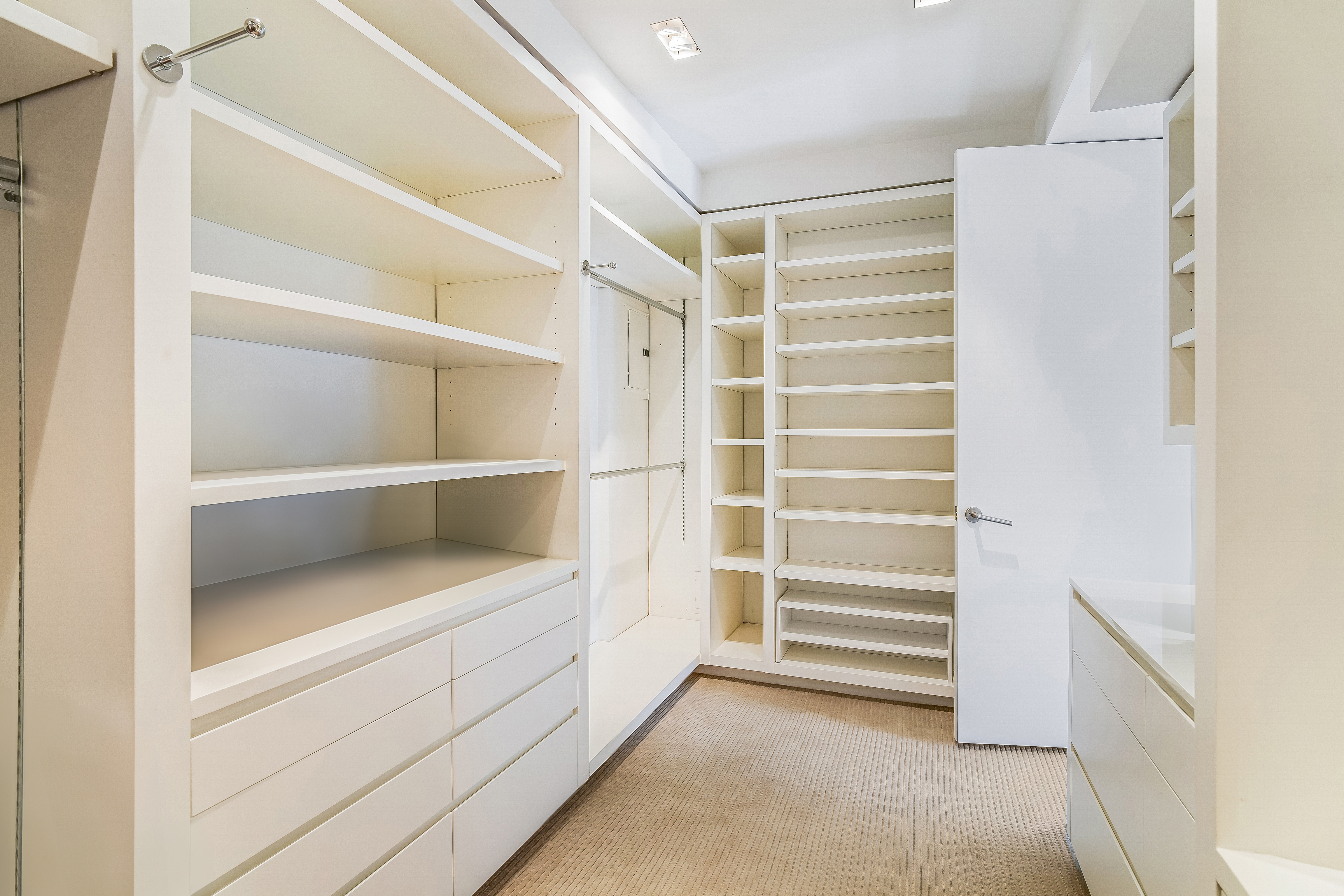 1 5th Avenue, Unit 5GH Manhattan, NY 10003 - Photo 18 of 26 a view of walk in closet with empty racks