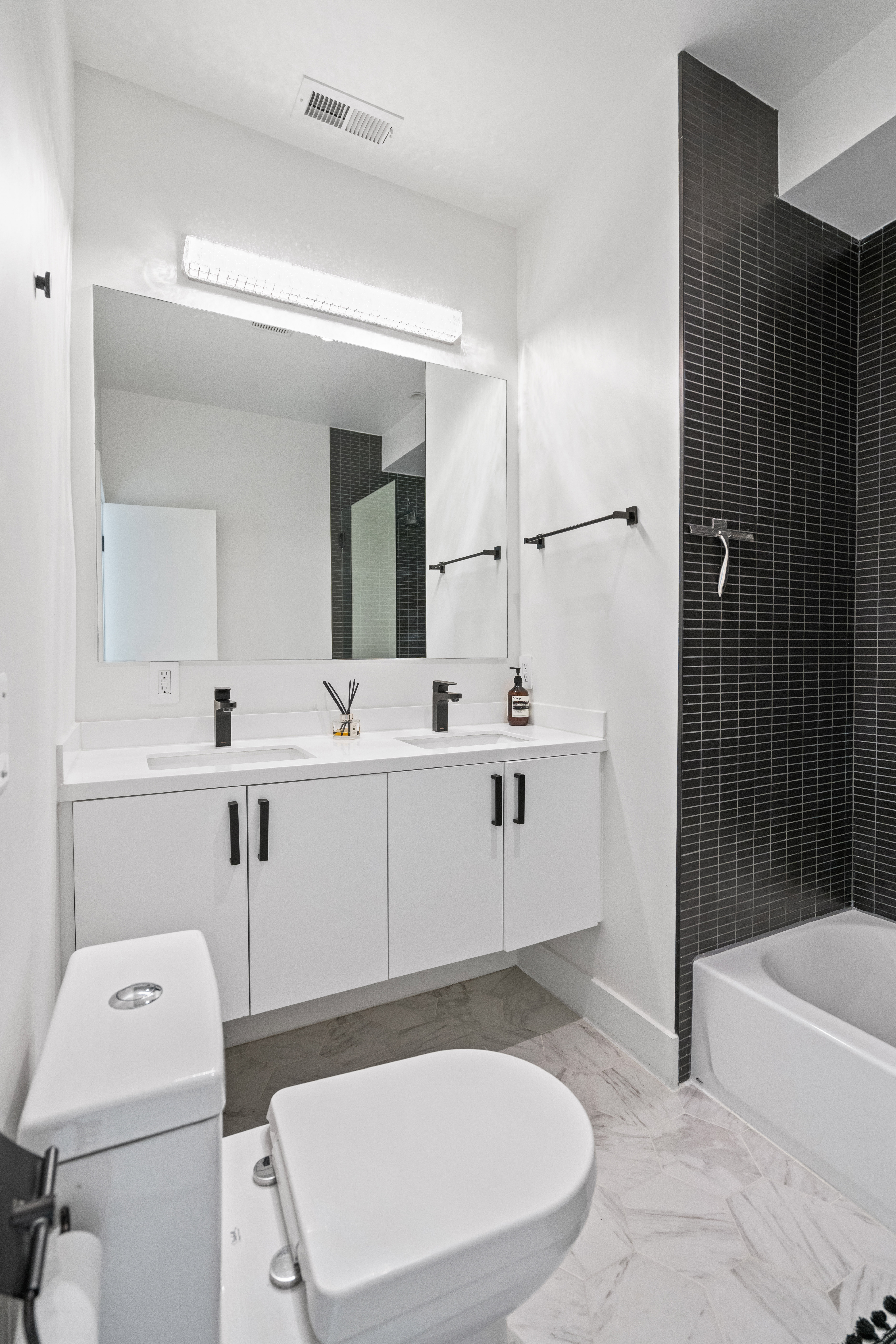 445 Ridge Street Northwest Washington, DC 20001 - Photo 23 of 43 a bathroom with a sink a toilet and shower