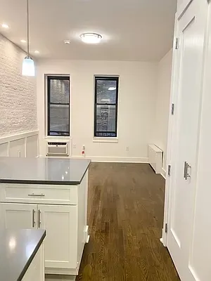 a bathroom with a sink a mirror and a shower