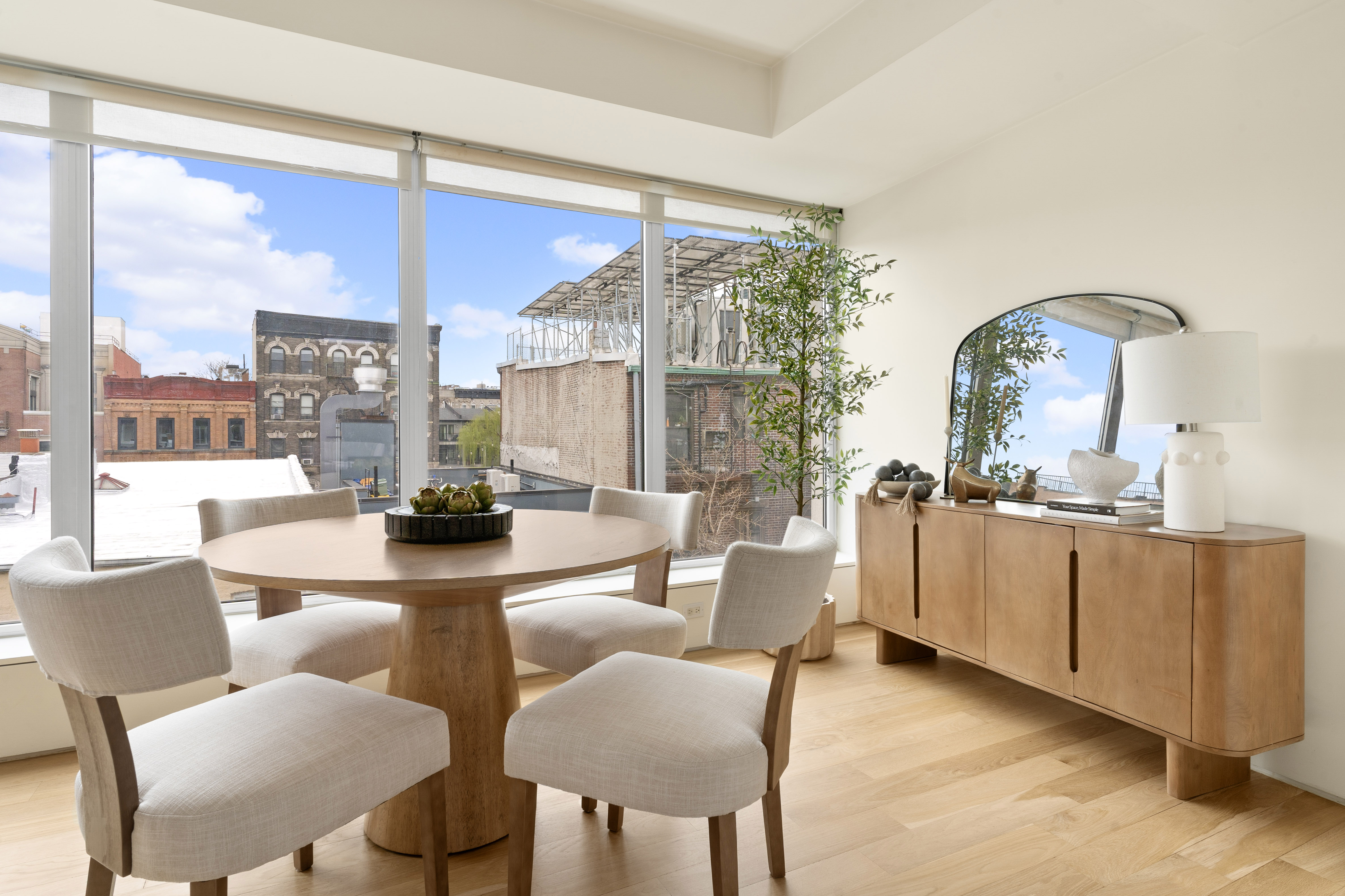 142 North 1st Street, Unit PH Brooklyn, NY 11249 - Photo 3 of 15 a dining room with furniture and a large window