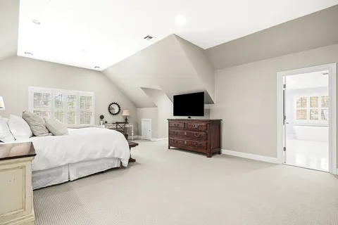 a living room with furniture and flat screen tv