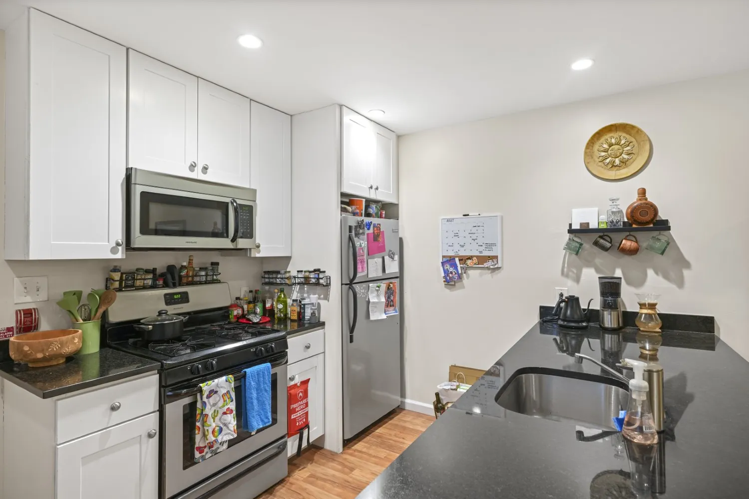 a bathroom with a toilet a sink and a mirror