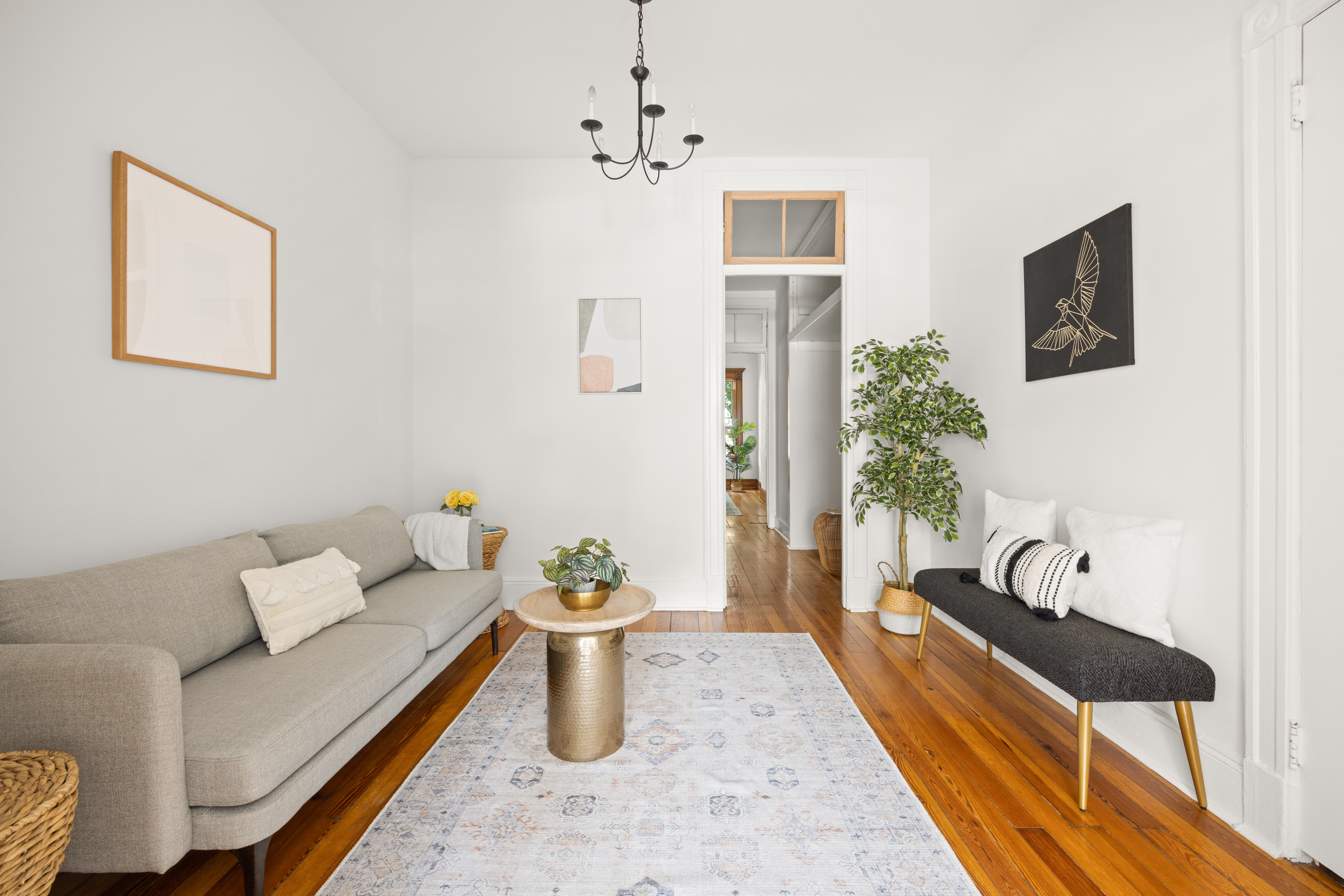 99 East 2nd Street Brooklyn, NY 11218 - Photo 5 of 24 a living room with furniture and a potted plant