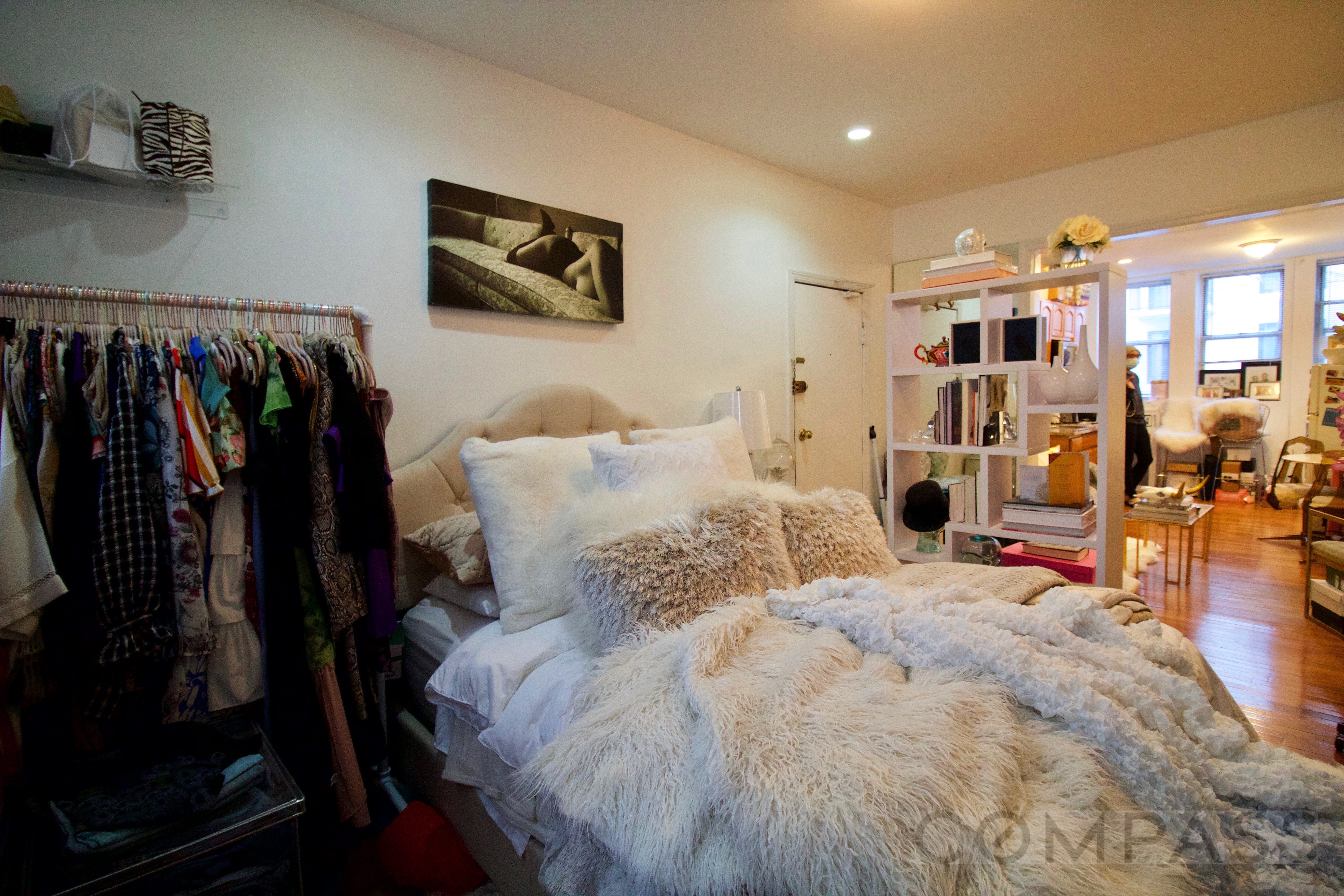 a bed room with a bed and a walk in closet