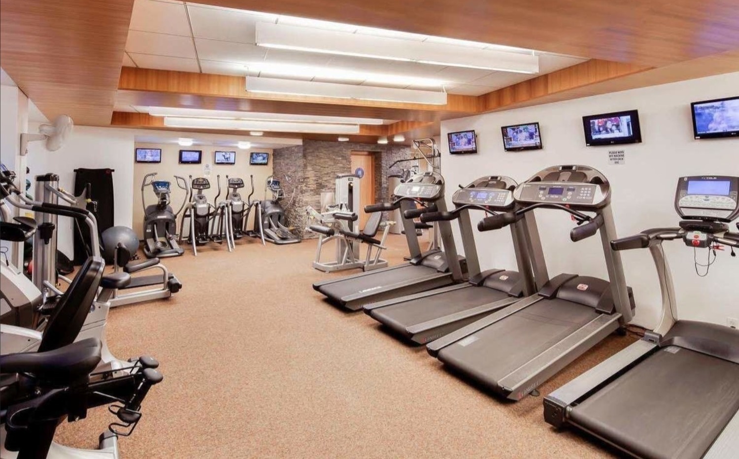 99 John Street, Unit 1711 Manhattan, NY 10038 - Photo 11 of 14 a view of a room with gym equipment